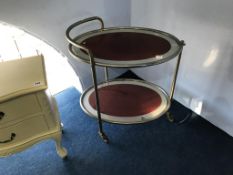 A chrome oval and glass trolley