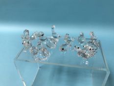 Twelve boxed miniature Swarovski glass animals