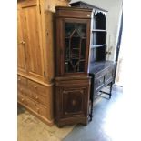 An Edwardian corner cabinet