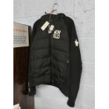 A Moncler jacket, with tag, size L