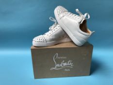 A pair of boxed Christian Louboutin 'Louis Junior Spikes' trainers, size 42