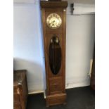 An oak long case clock