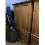 A pine wardrobe and chest