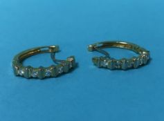 A pair of diamond(?) mounted earrings