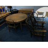 A teak G Plan circular table, chairs and two Ercol chairs