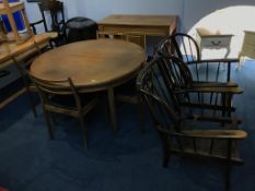 A teak G Plan circular table, chairs and two Ercol chairs