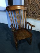 An elm lathe back rocking chair