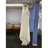 An Oleg Cassini ivory wedding dress, size 14 (with labels, cost £850)