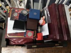 A collection of commemorative coins and 1st day covers etc.