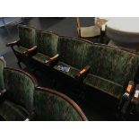 A single row of four vintage cinema seats