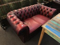 A Chesterfield two seater settee and Club chair