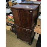 A mahogany bow cocktail cabinet