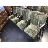 A single row of four vintage cinema seats