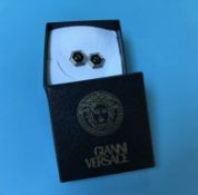 A boxed pair of Versace cufflinks