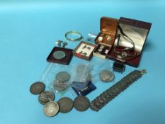 A tray of assorted, to include commemorative crowns, various wristwatches etc.