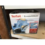 A boxed Tefal air glide