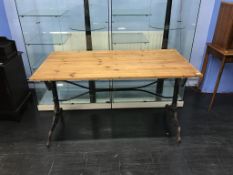 A pine top and metalwork table