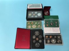 A collection of various world coins, Canada and US
