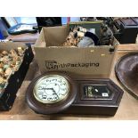 A box of assorted and a wall clock