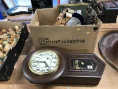 A box of assorted and a wall clock