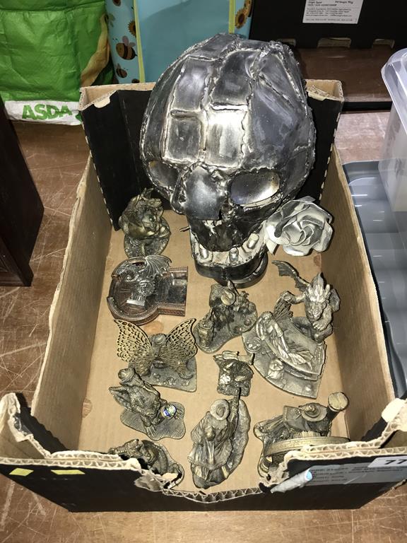 A metalwork skull etc.
