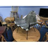 A 1960's black and white woven chair