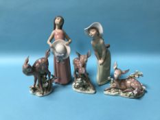 Two boxed Lladro figures and three boxed Lladro 'Fawns'