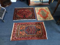 Three Persian design rugs