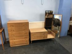 An oak chest of drawers and a dressing table