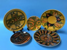 Five various Poole pottery wall plates
