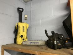 A chainsaw and a Karcher