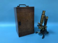 A cased Baker of London microscope