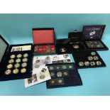 A collection of royal commemorative coins and covers