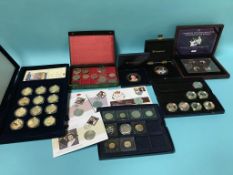 A collection of royal commemorative coins and covers