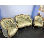 An as new Continental style button back floral three piece suite, with gilt framework