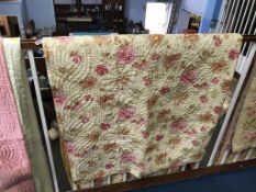 A Durham quilt with roses, with pink and mustard yellow striped reverse, 235 x 198cm