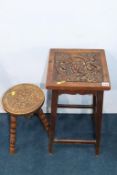 A carved oak stool and carved oak table