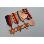 A group of five unnamed World War II medals, to include Africa and Atlantic stars