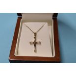A 9ct gold cross and chain, 2g