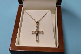 A 9ct gold cross and chain, 2g