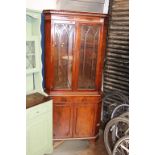 A mahogany corner cabinet