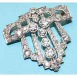 An Art Deco white metal brooch, mounted with approx. 5ct of diamonds, 8.7g, 32.5mm x 34mm approx.
