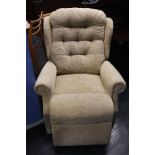 An electric rise and recliner armchair