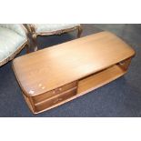 An Ercol coffee table, with two drawers
