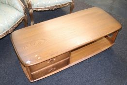 An Ercol coffee table, with two drawers
