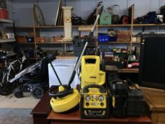 A Karcher and various power tools