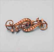 A 9ct gold brooch, mounted with seed pearls, 3g