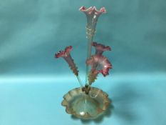 A Victorian pale cranberry glass four trumpet epergne