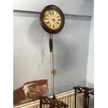 A mahogany wall clock