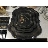 A set of three Victorian graduated papier mache trays, 70 x 59cm largest